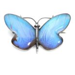 AN ANTIQUE FOILED CRYSTAL BUTTERFLY BROOCH in silver, designed as a butterfly, its wings decorated