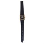 A LADIES TANK WRISTWATCH, CARTIER rounded rectangular case in gold plated silver, sapphire jewel,