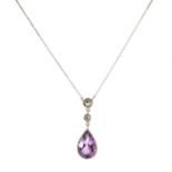 AN AMETHYST AND DIAMOND NECKLACE in white gold, set with a pear cut amethyst of 2.60 carats below