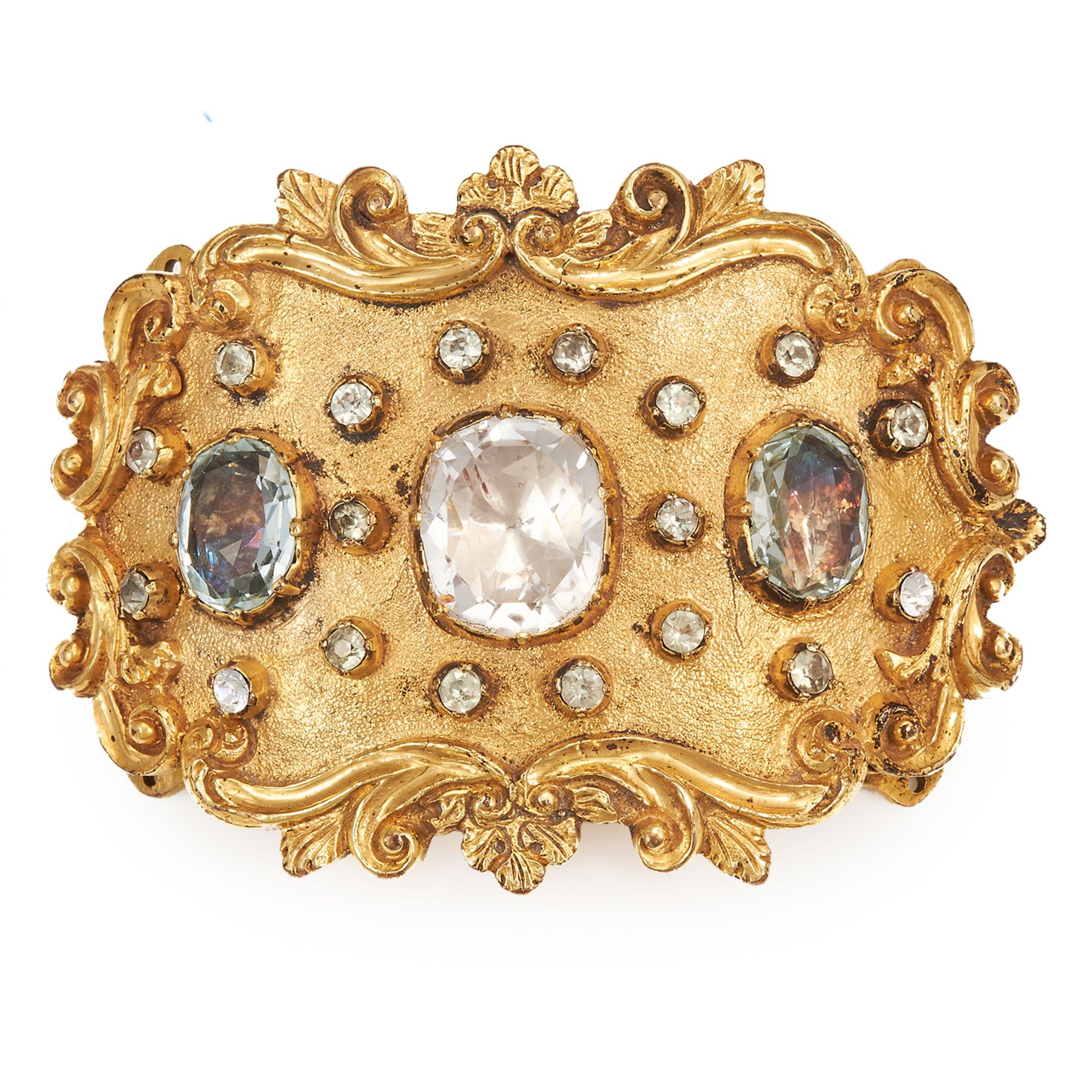 AN ANTIQUE JEWELLED MOURNING CLASP of oval form with scrolling, serpentine borders, jewelled with