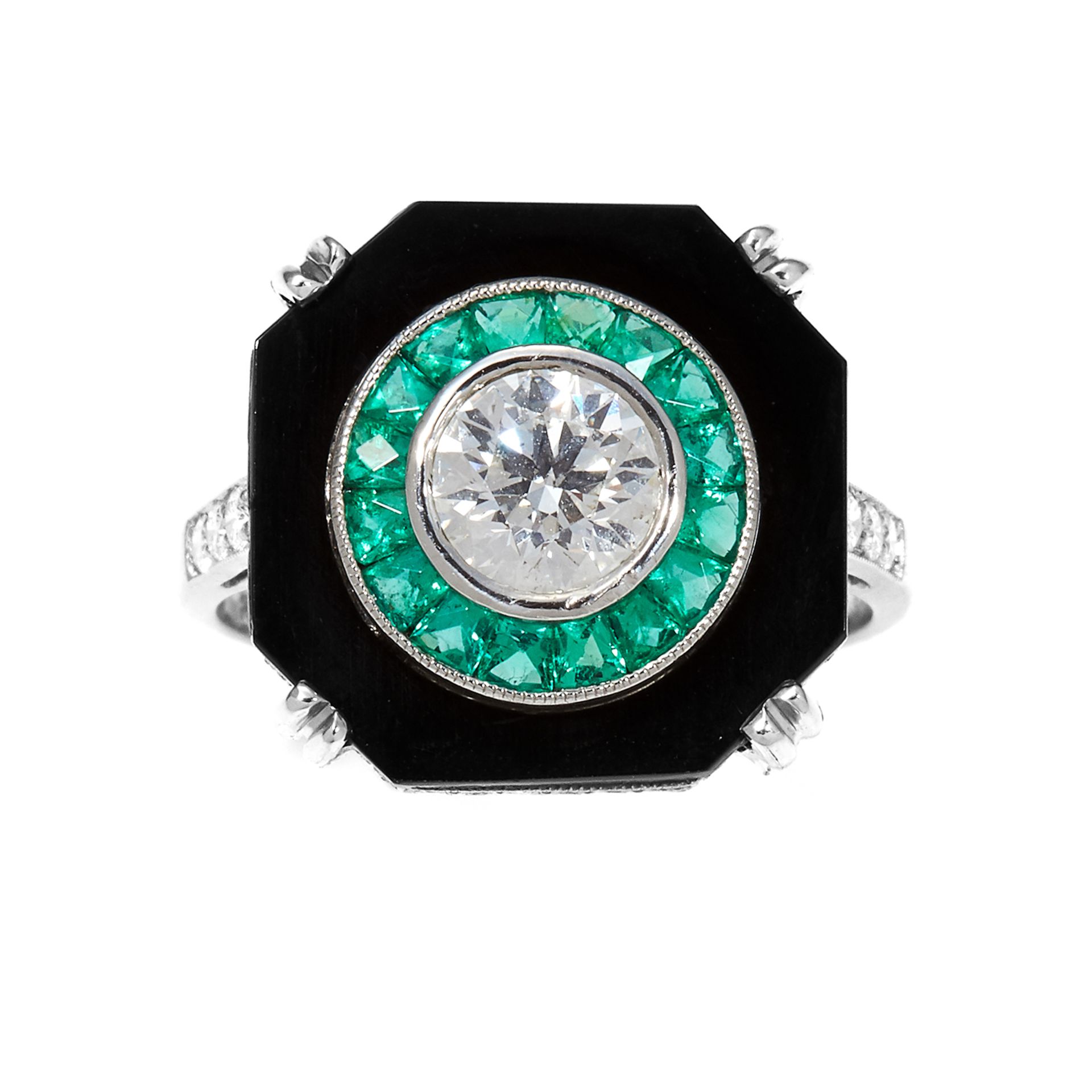 A DIAMOND, EMERALD AND ONYX DRESS RING in platinum, set with a central round cut diamond of 0.85