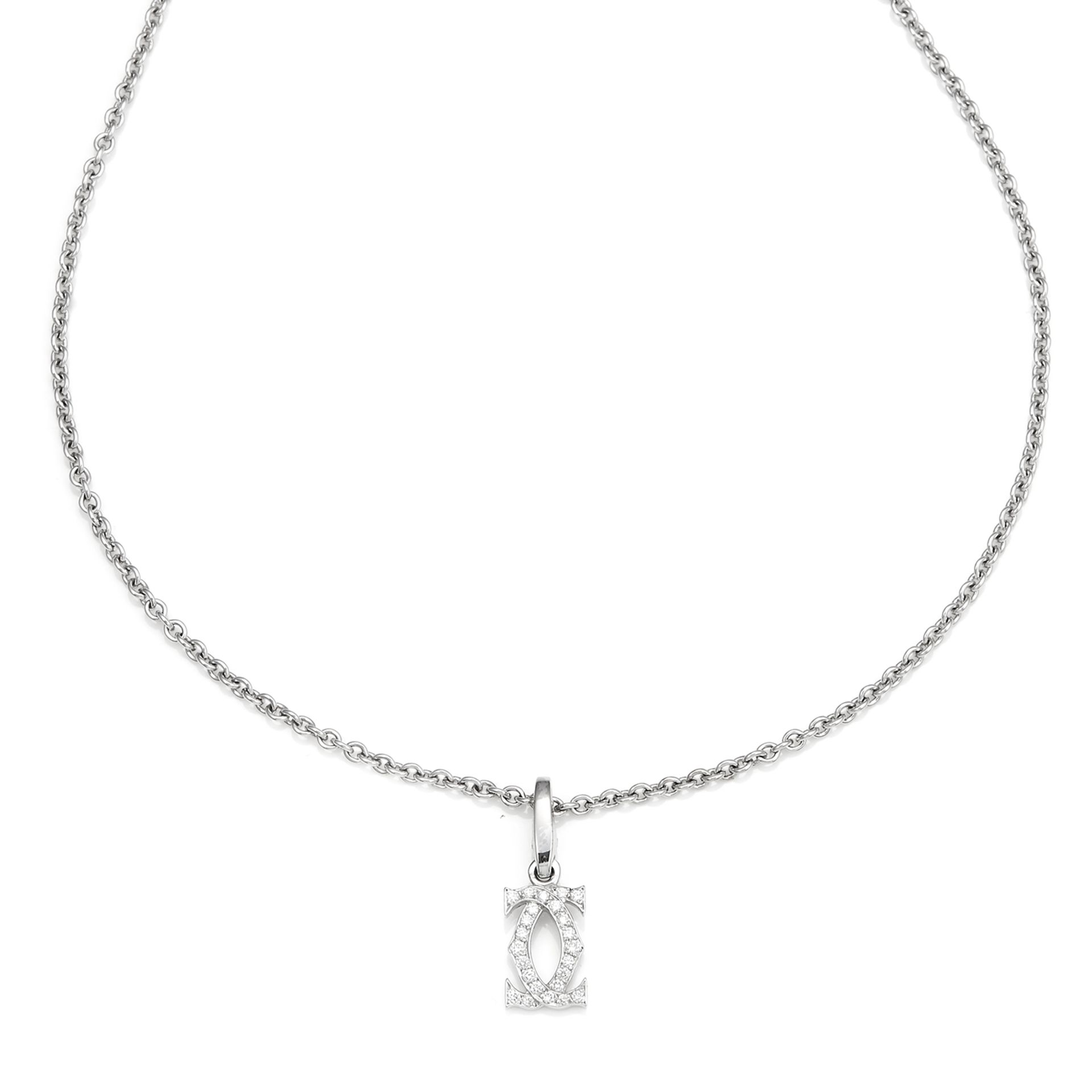 A DIAMOND C DE CARTIER PENDANT in 18ct white gold, the C de Cartier motif is jewelled with round cut