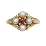 AN ANTIQUE RUBY AND PEARL RING, 19TH CENTURY in high carat yellow gold, set with an oval cut ruby