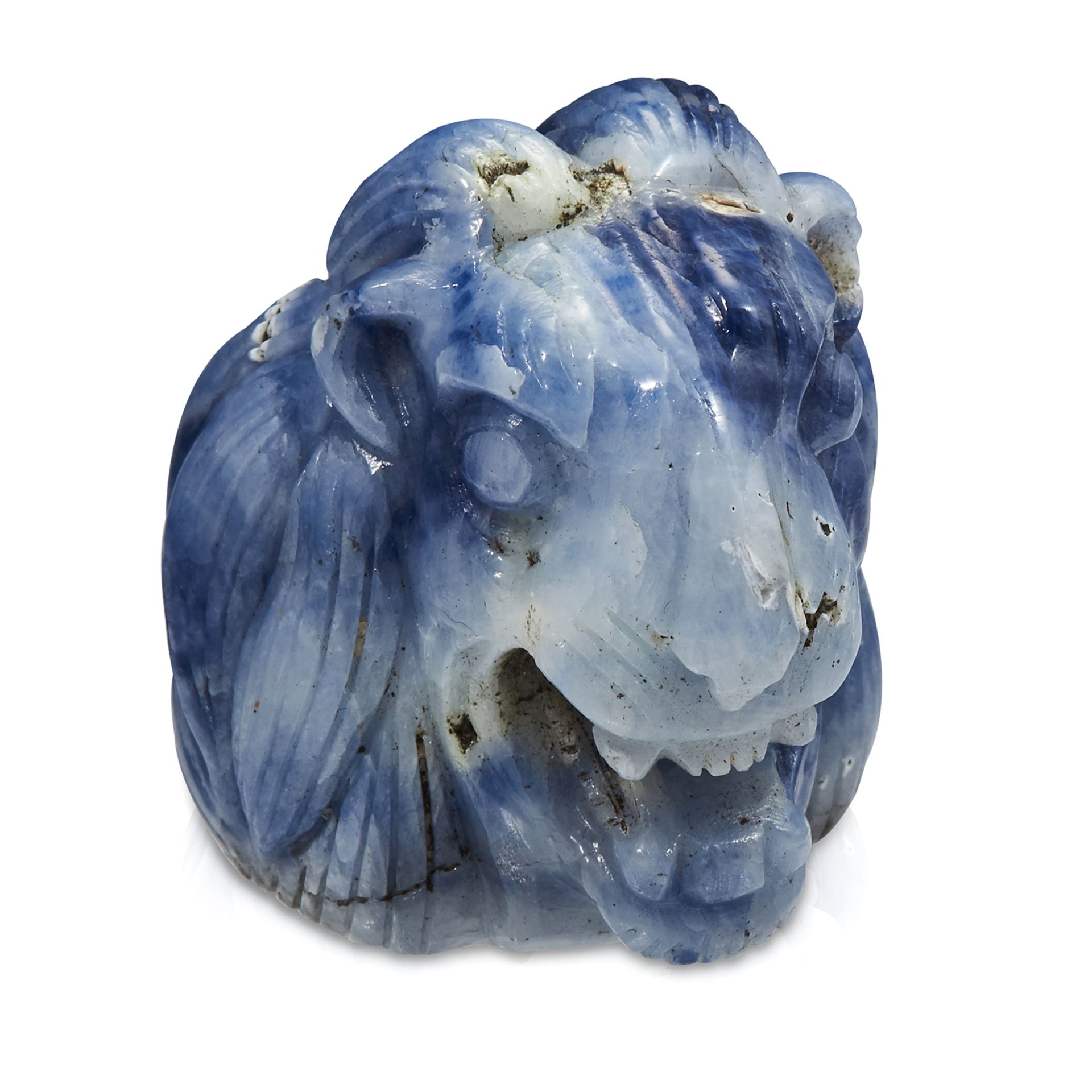 A 520 CARAT CARVED SAPPHIRE STATUE OF A LIONS HEAD, carved in detail to depict a lion roaring, 4.