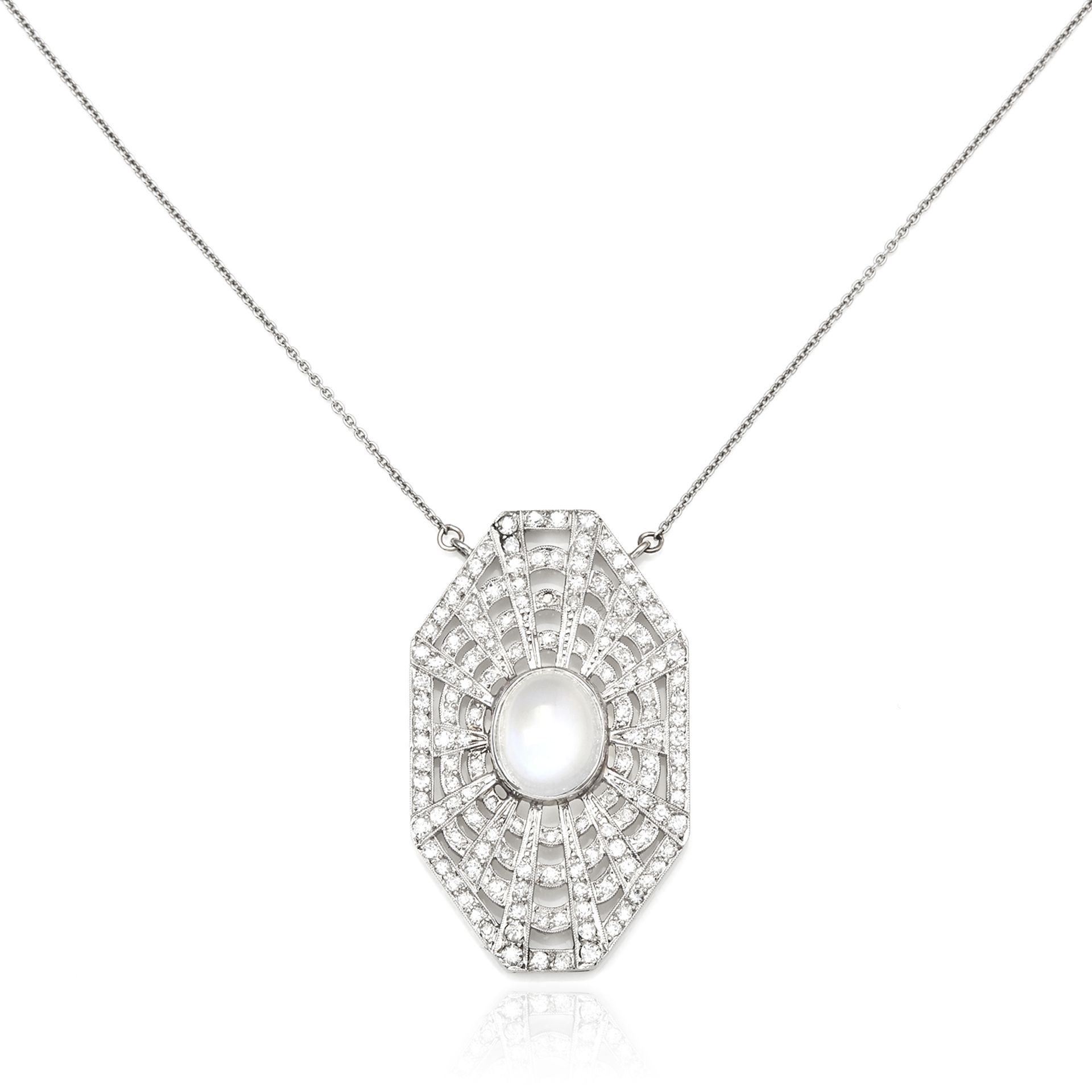AN ART DECO MOONSTONE AND DIAMOND PENDANT in platinum, set with a central oval cabochon moonstone,