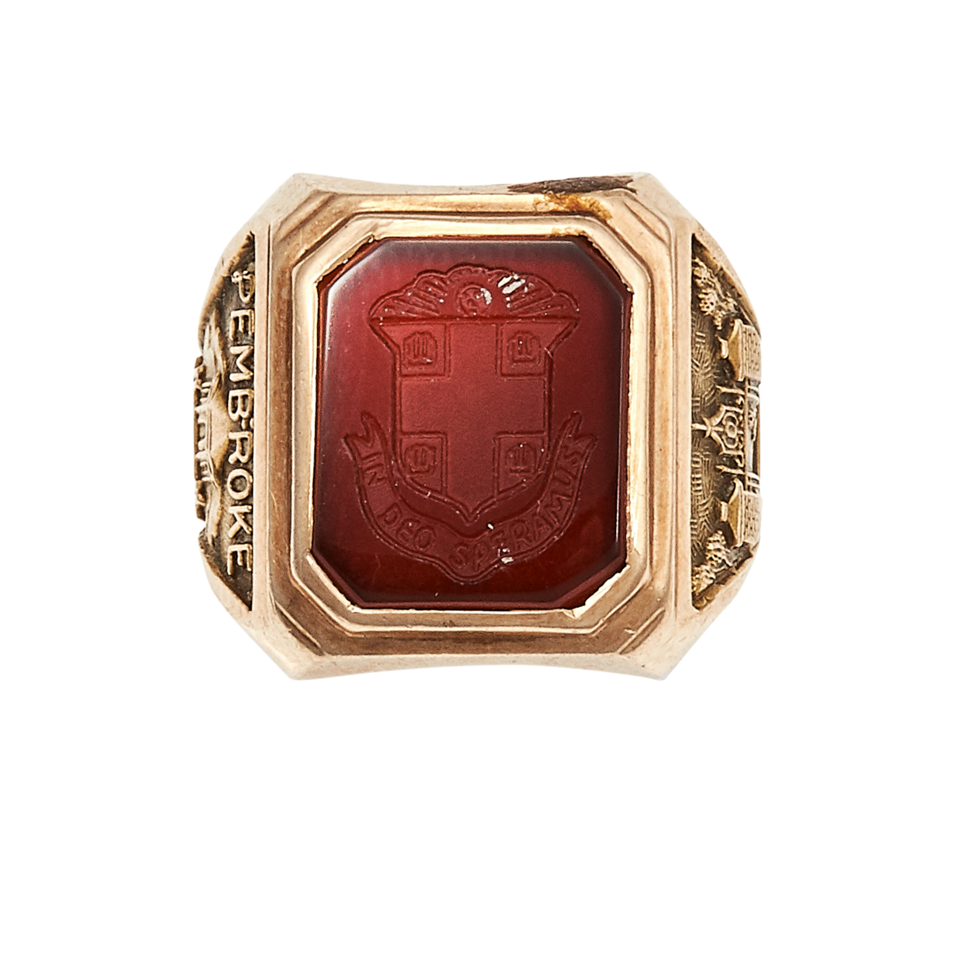 A BROWN UNIVERSITY CARNELIAN INTAGLIO RING FOR PEMBROKE COLLEGE in yellow gold, the cut cornered