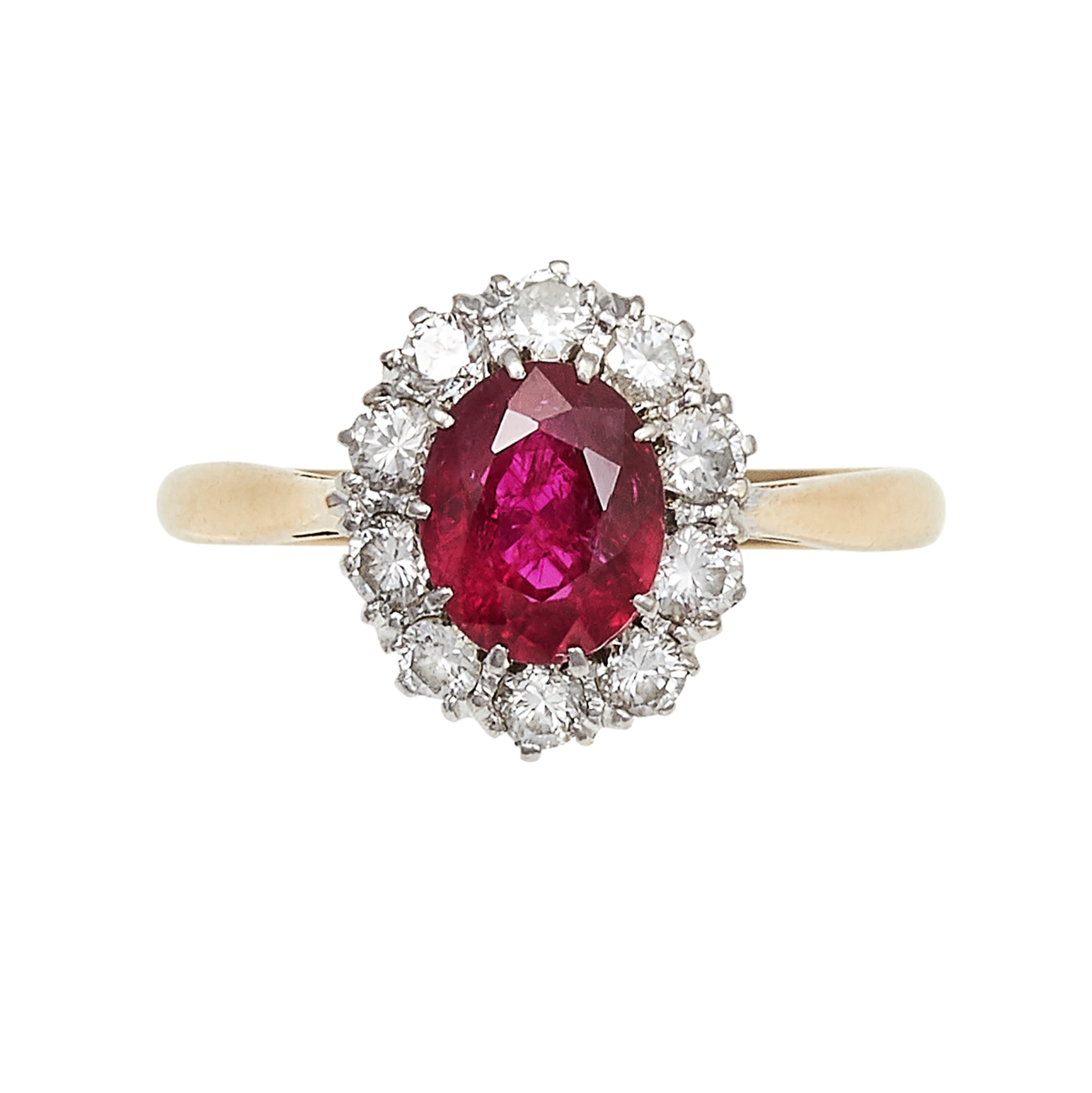 A RUBY AND DIAMOND RING in 18ct yellow gold and platinum, set with an oval cut ruby of 1.0 carats