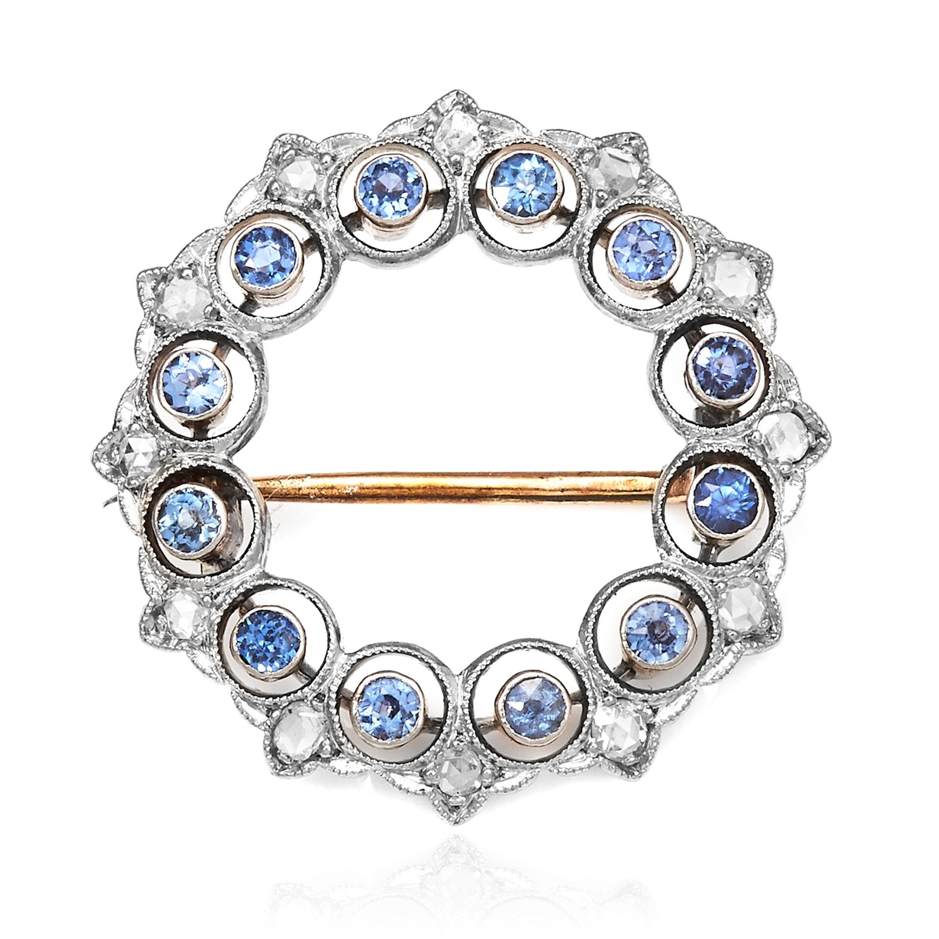 AN ANTIQUE SAPPHIRE AND DIAMOND BROOCH in yellow gold and platinum, the circular motif is jewelled