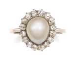 A NATURAL SALTWATER PEARL AND DIAMOND CLUSTER RING in platinum, set with a central pearl of 9.8mm
