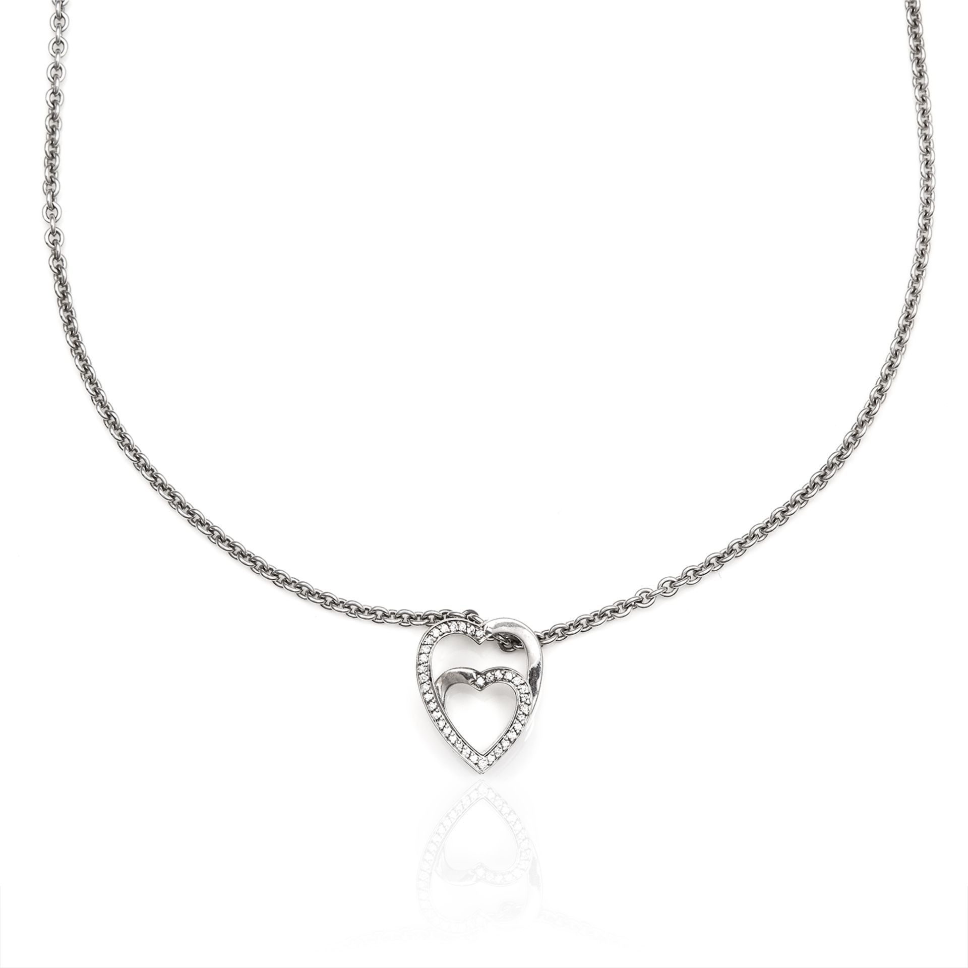 A DIAMOND DOUBLE HEART PENDANT, CARTIER in 18ct white gold, comprising of two interlinking hearts,