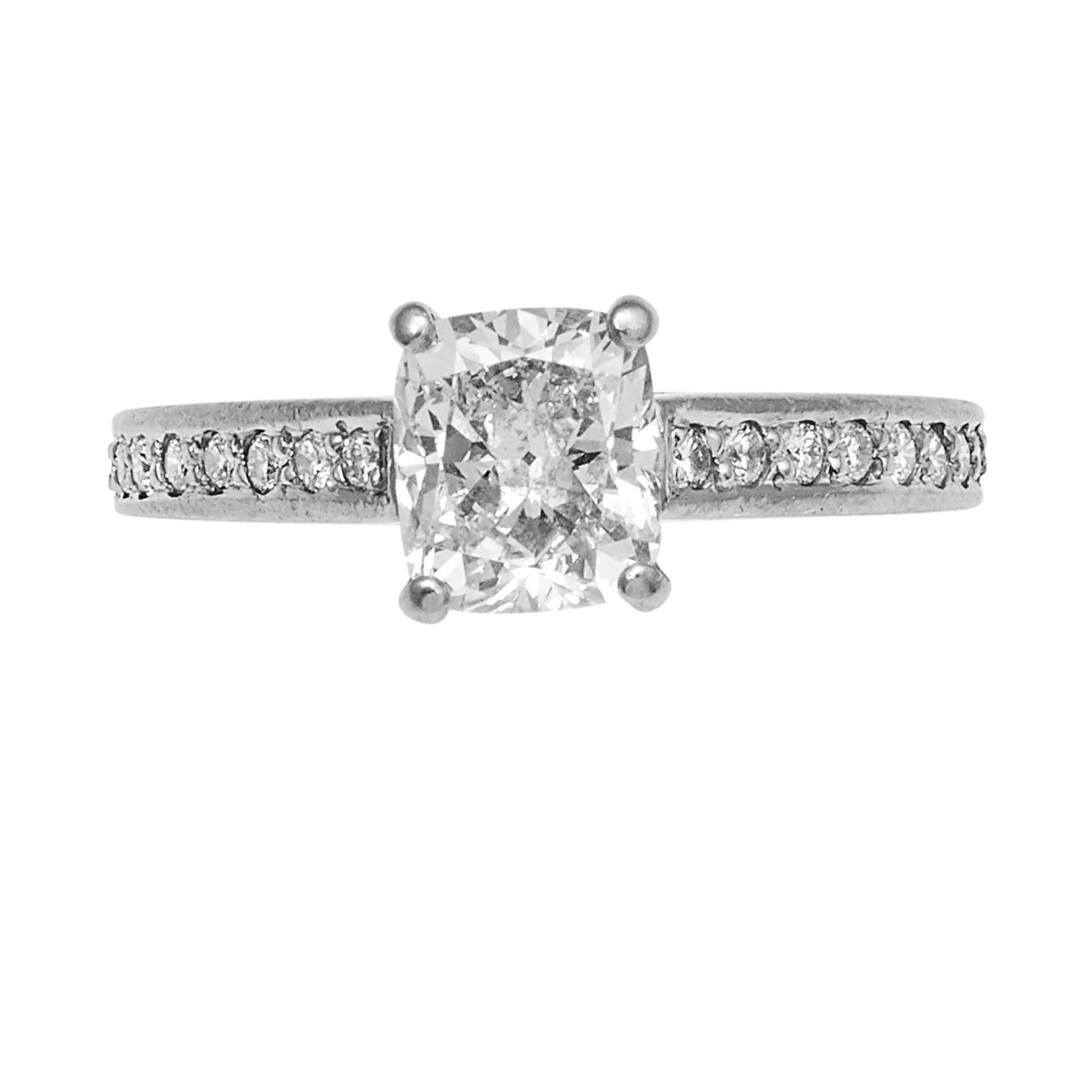 A 1.28 CARAT SOLITAIRE DIAMOND ENGAGEMENT RING in platinum, set with a central cushion cut diamond