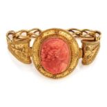 AN ANTIQUE CORAL CAMEO BRACELET, 19TH CENTURY in high carat yellow gold, set with an oval carved