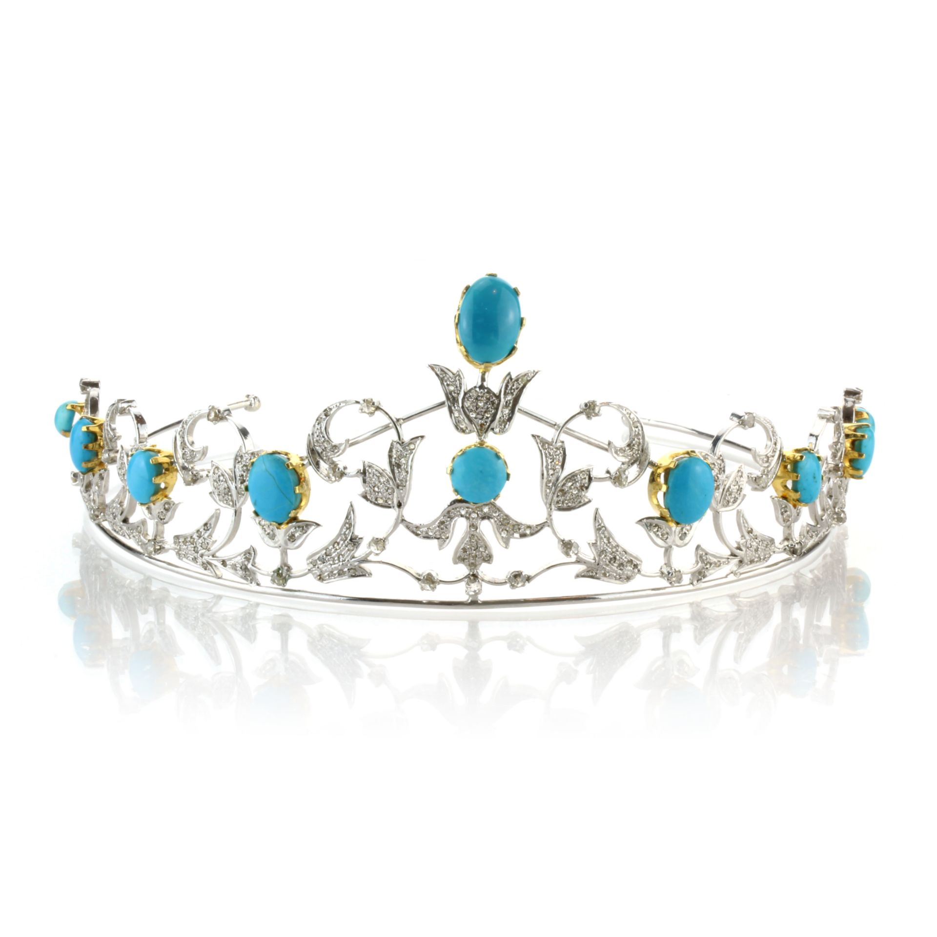 A TURQUOISE AND DIAMOND TIARA in yellow and white metal set with ten large turquoise cabochons