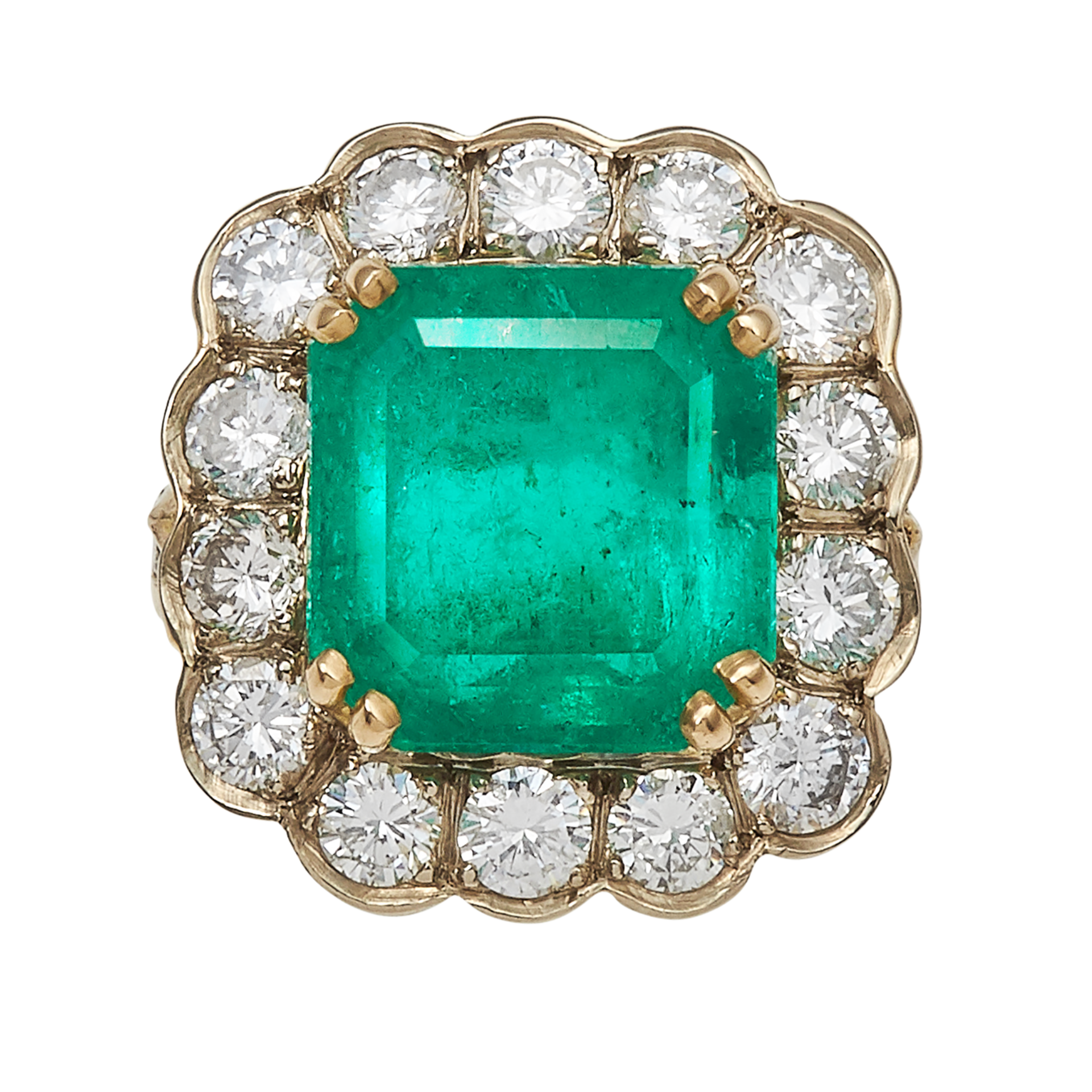 AN EMERALD AND DIAMOND RING in 18ct yellow and white gold, set with a central step cut emerald of