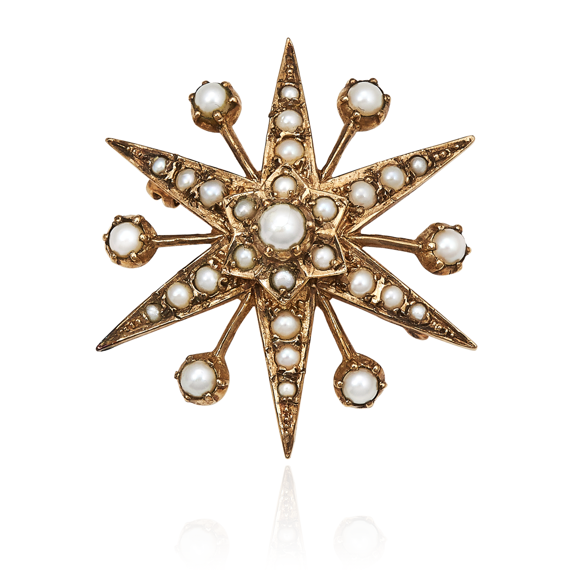 AN ANTIQUE PEARL STAR BROOCH in yellow gold, designed as a star motif, jewelled with pearls,