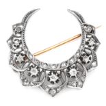 AN ANTIQUE DIAMOND CRESCENT BROOCH in 18ct yellow gold and silver, designed as a crescent jewelled