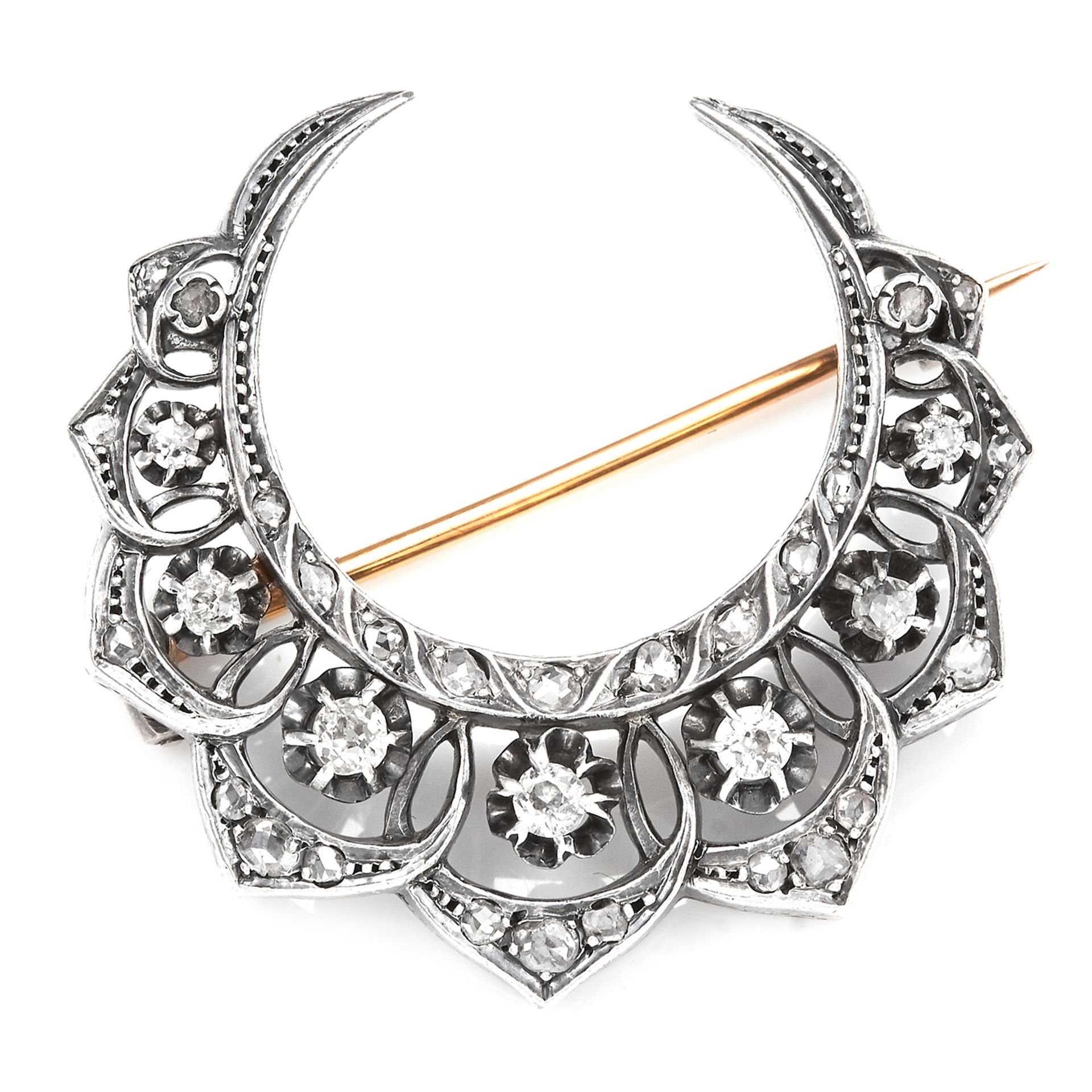 AN ANTIQUE DIAMOND CRESCENT BROOCH in 18ct yellow gold and silver, designed as a crescent jewelled