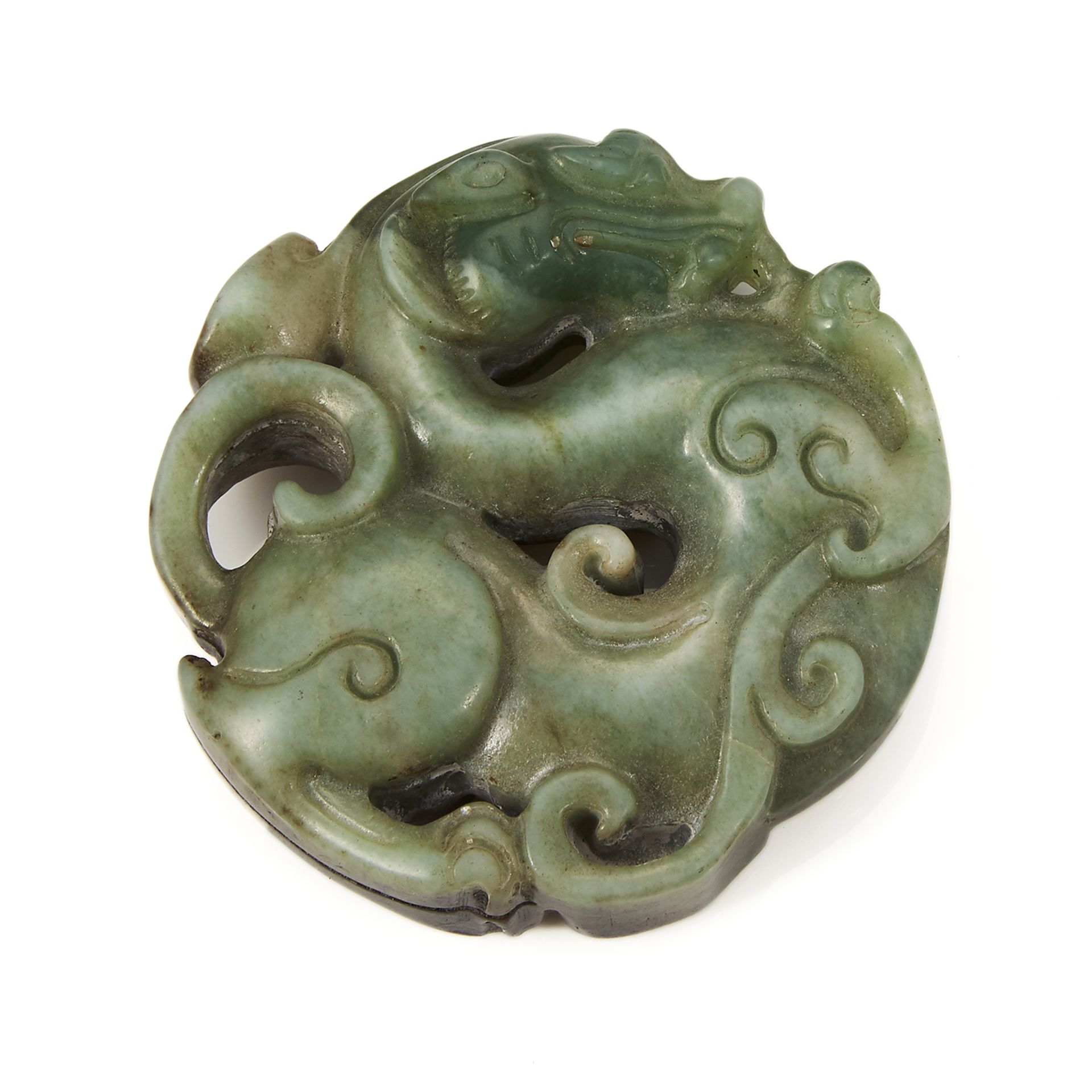 A CHINESE JADE DRAGON PLAQUE of circular form, carved depicting a dragon coiled around itself with