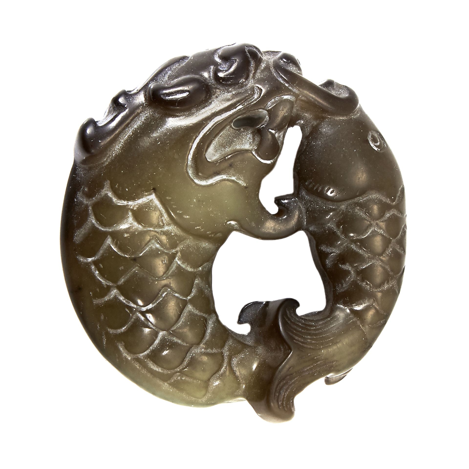 A CHINESE JADE FISH PLAQUE of circular form, carved depicting two fish swimming around one