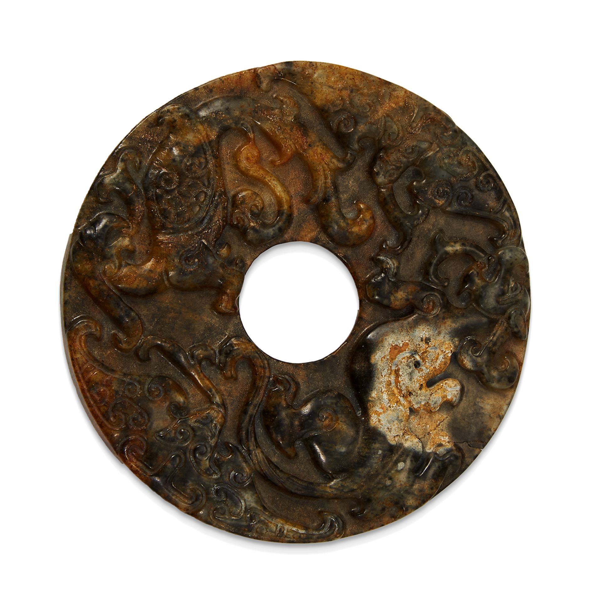 A CHINESE JADE DISC of circular form carved in high relief depicting various animals within