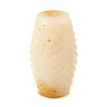 A CHINESE WHITE JADE BEAD of barrel form, carved with textured crosshatch decoration, 4.6cm, 53g.