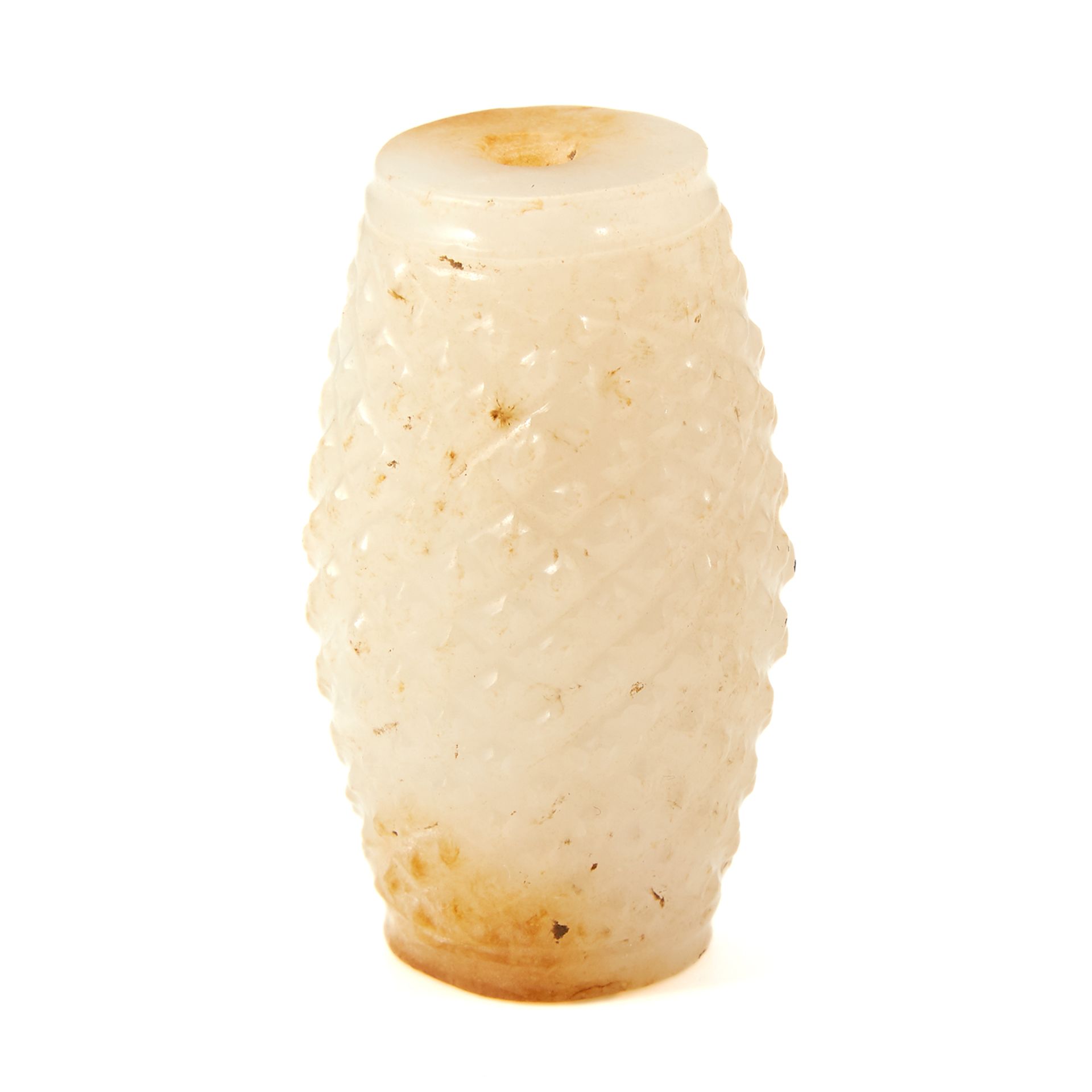 A CHINESE WHITE JADE BEAD of barrel form, carved with textured crosshatch decoration, 4.6cm, 53g.