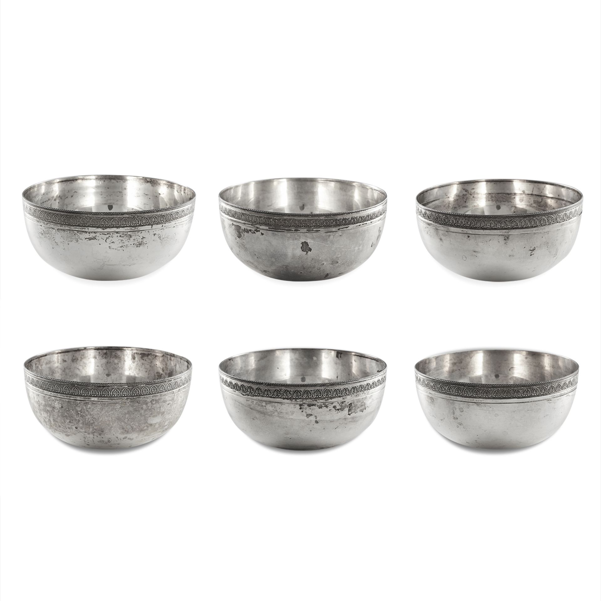 A SET OF SIX LEBANESE SILVER BOWLS / DISHES each of circular design with a foliate border, 11.0cm,