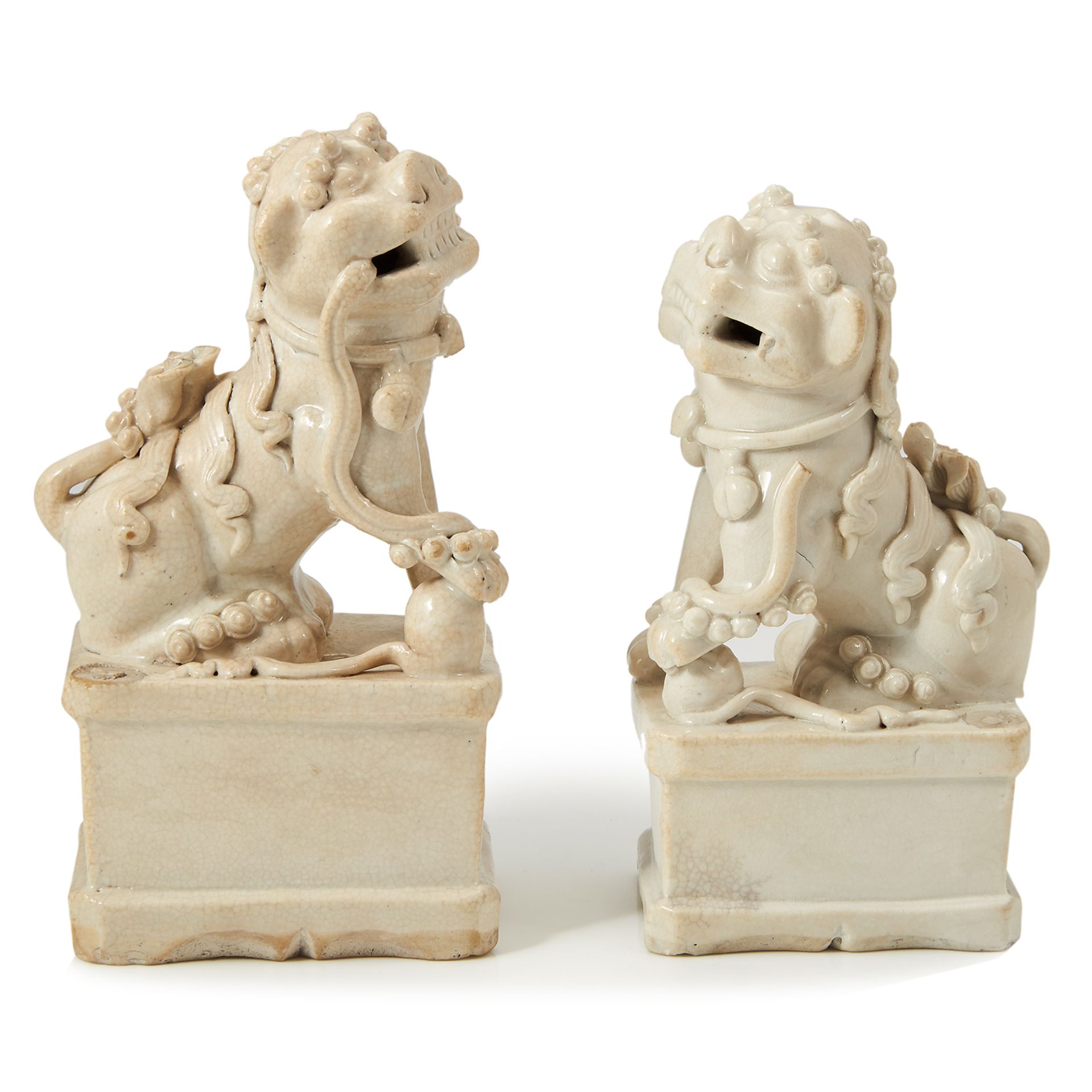 A PAIR OF ANTIQUE CHINESE PORCELAIN DOGS OF FOO, 17TH CENTURY OR LATER each atop a rectangular base,