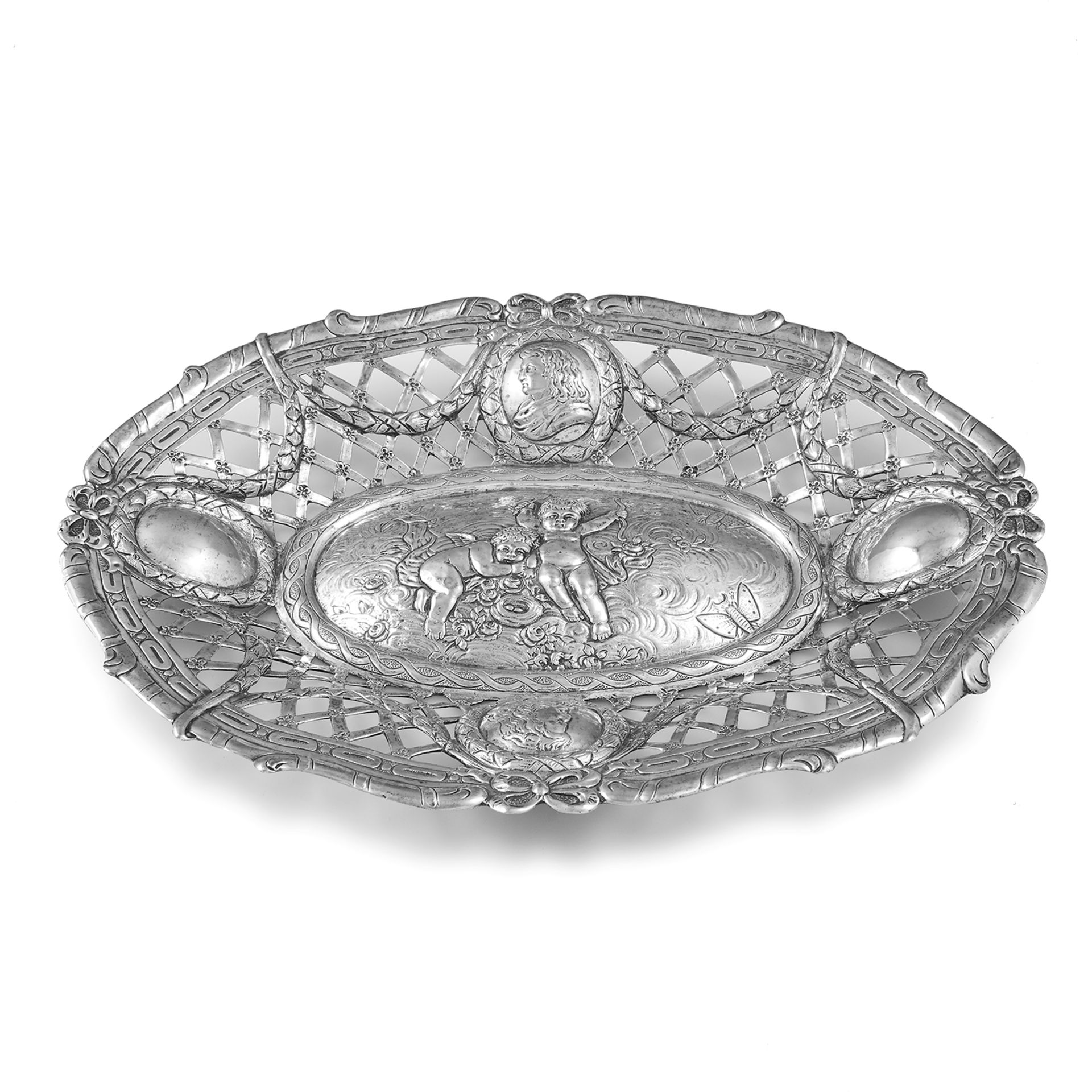 AN ANTIQUE GERMAN SILVER DISH of oval form with pierced and chased decoration, a scene of cherubs to