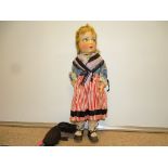 A 1930s vintage doll originally from the Savoie region of France. Composite face and hands, soft
