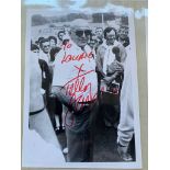 A large number of photographs presented in an album that feature personally signed autographs &