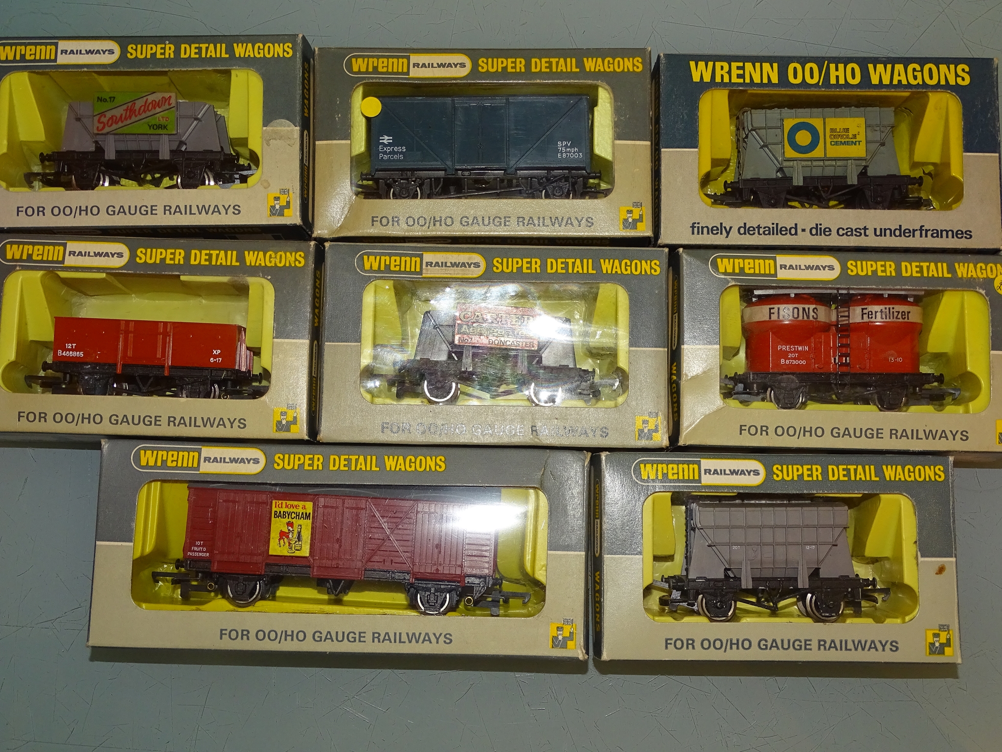 A group of wagons and vans by WRENN Railways to include Fisons Fertiliser and Babycham examples -