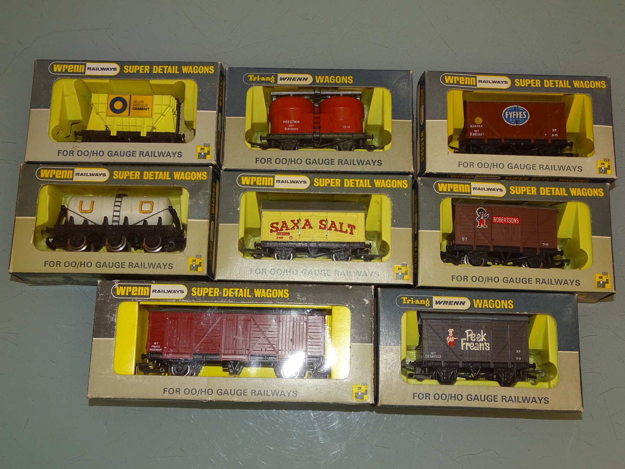 A group of owner wagons by WRENN Railways to include Fyffes, Saxa Salt and Peek Freans examples -