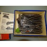 A box containing a large quantity of TRIX EXPRESS 3 rail track including points and crossovers etc -