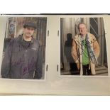 A large number of photographs presented in an album that feature personally signed autographs &