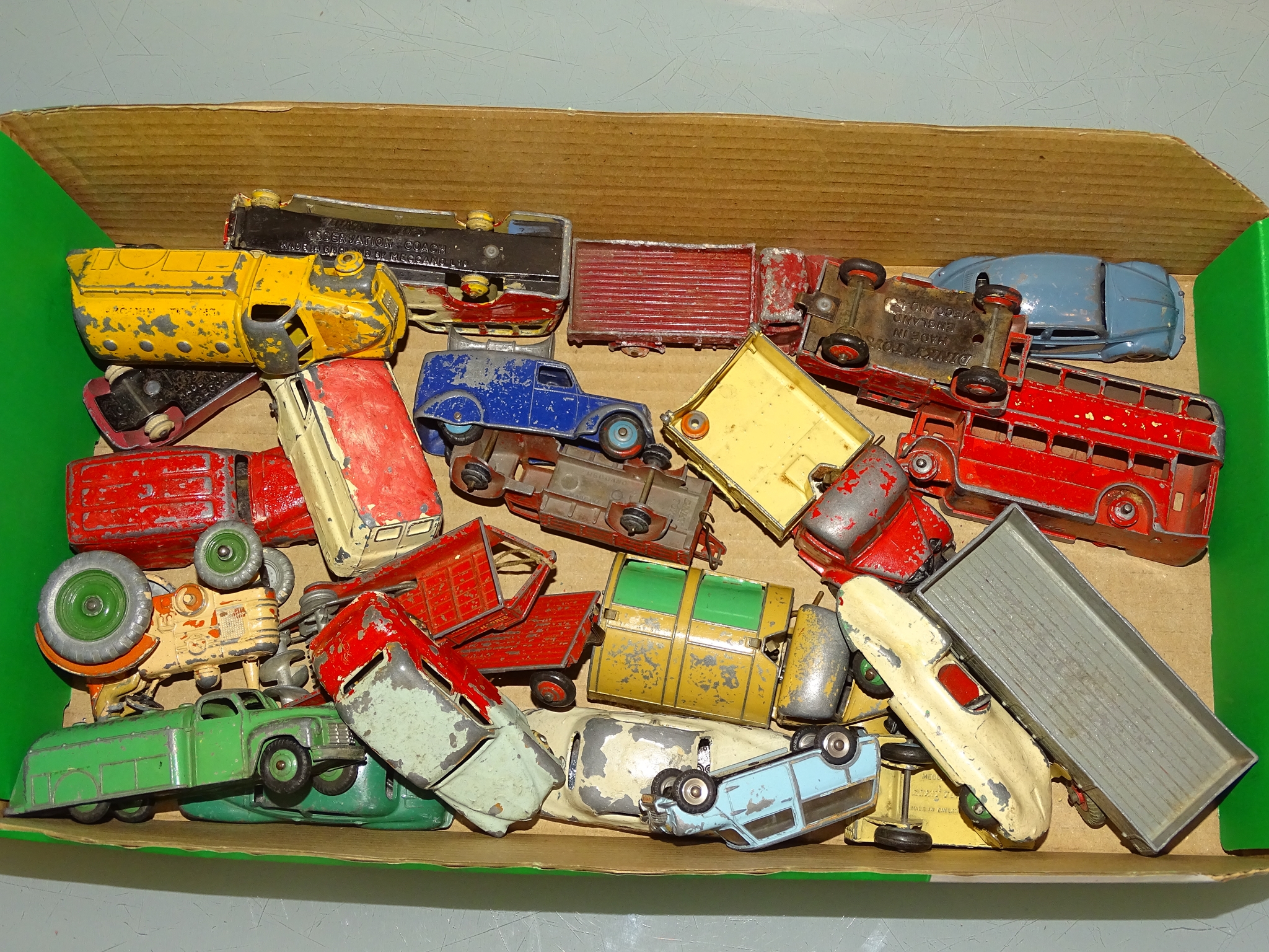 A tray of mixed diecast cars, vans, lorries etc by various manufacturers including DINKY in playworn