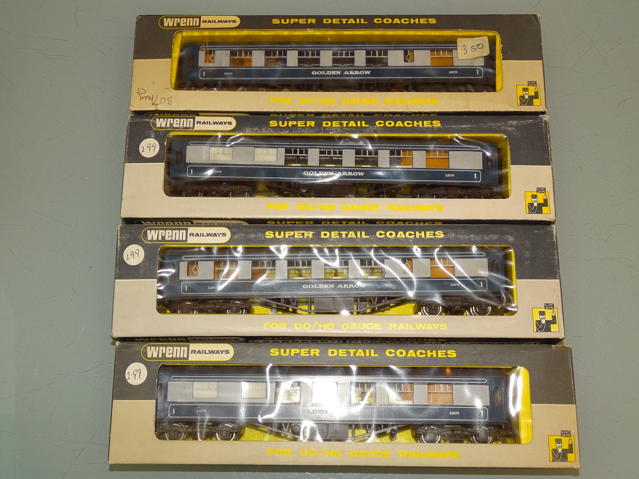 A group of four WRENN Railways Golden Arrow coaches as lotted - VG/E in F boxes (4)