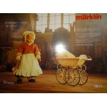 A MÄRKLIN 'KINDERTRAUM' 1611 limited edition tinplate reproduction DOLL'S PRAM AND HEIDI OTT DOLL