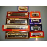 A group of wagons and coaches by various manufacturers to include MAINLINE, HORNBY Railways,