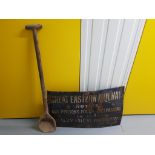 A vintage enamel Great Eastern Railways 'Trespassing Notice' together with a wooden 'shovel' (