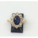 18ct gold sapphire (1.50ct) and diamond (1.0ct) diamond cluster ring (sz N)