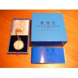 9ct gold gents dress open face pocketwatch, by Garrard. T bar chain (10" and 16.3g) Boxed with