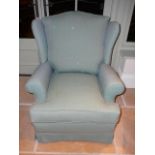 Contemporary upholstered armchair in turquoise