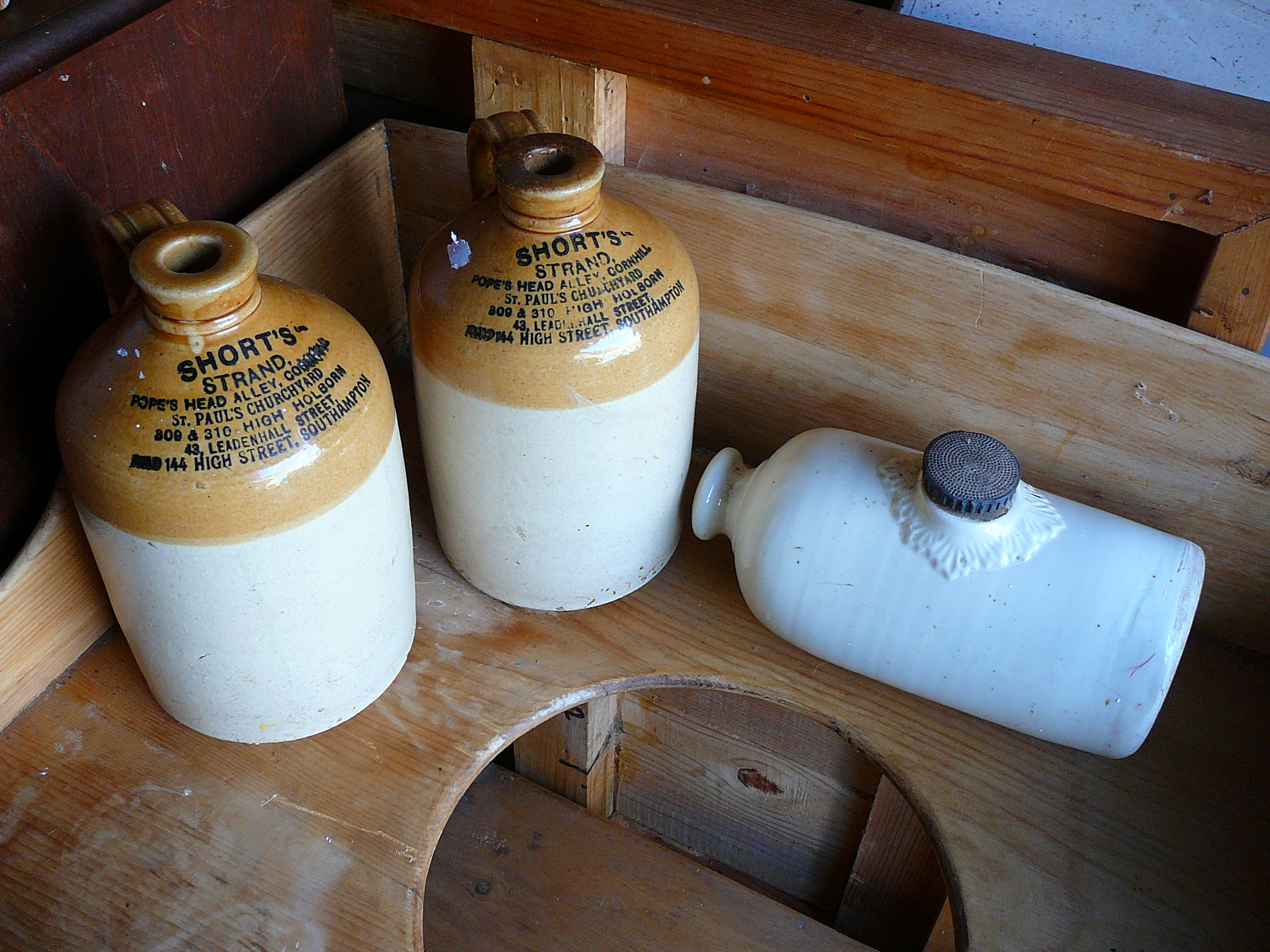 Stoneware hot water bottle and two stoneware flagons