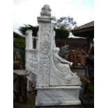 Very large marble Coliseum style crescent and galleried garden seat with reclining figure ends. (Due