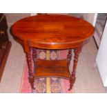 Oval two tier Victorian rosewood occasional table with marquetry inlay
