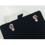 18ct white gold ruby and diamond (0.04ct total) earrings