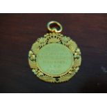 Malasian yellow metal commemorative medallion