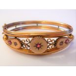 Victorian 9ct gold bangle set with rubies and diamonds