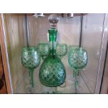 Green glass decanter and six matching glasses